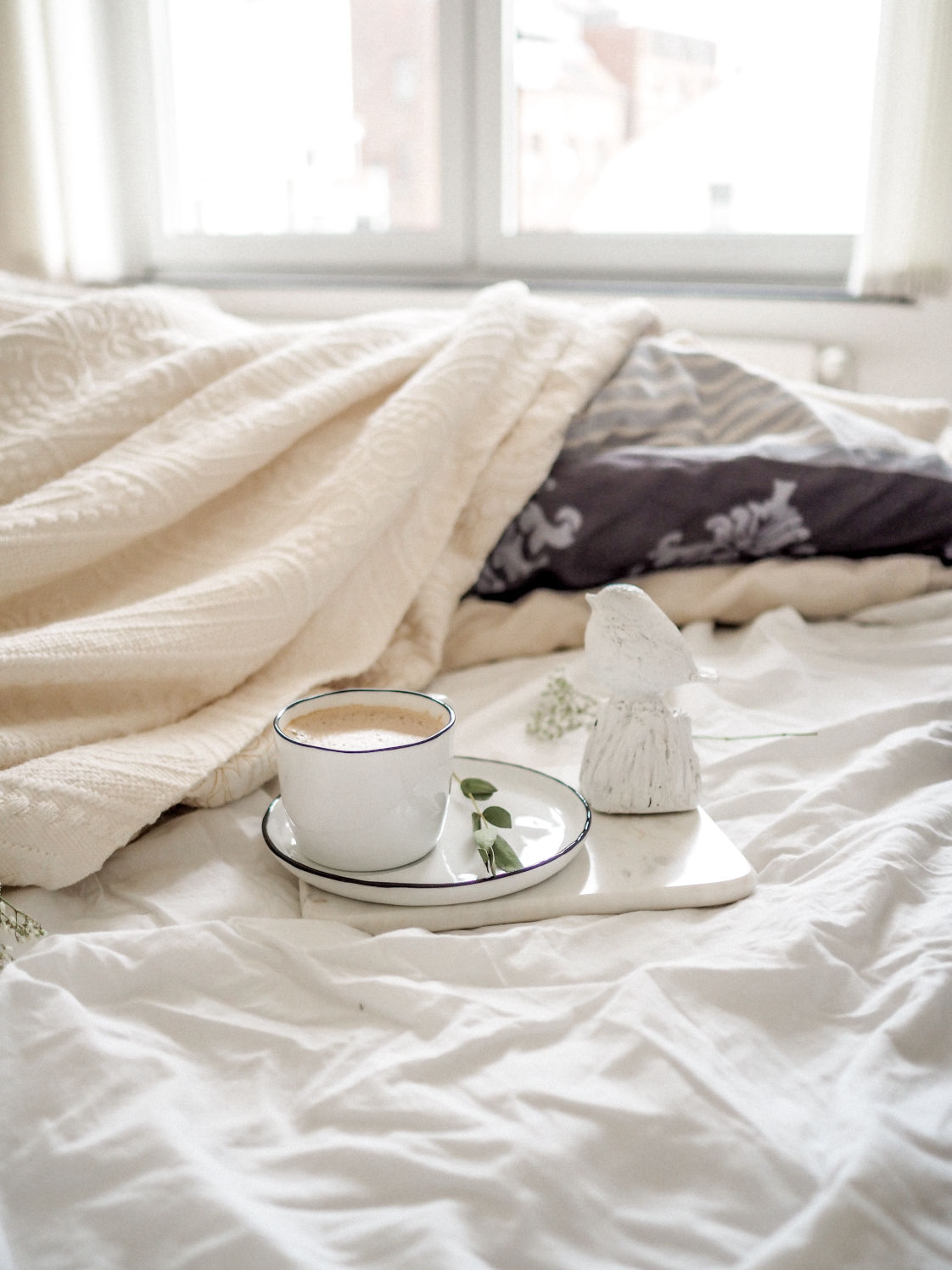 coffe cup on a bed
